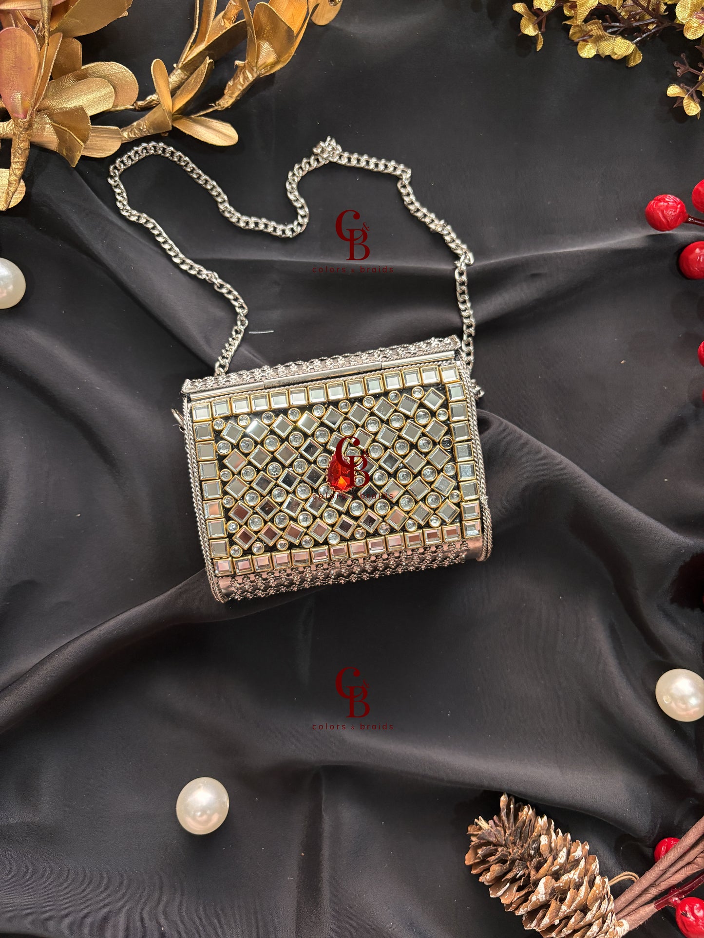 Sharvi Silver Kundan Clutch - Red Stones