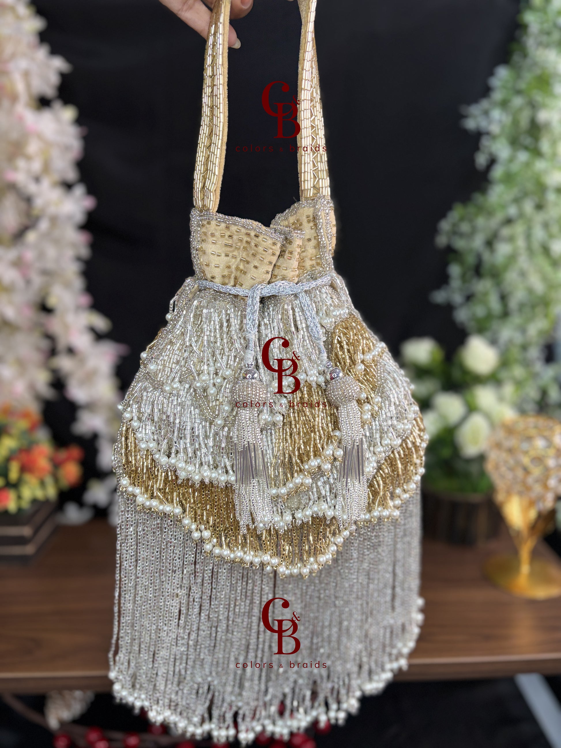 Silver and gold handcrafted fringe potli with pearl detailing