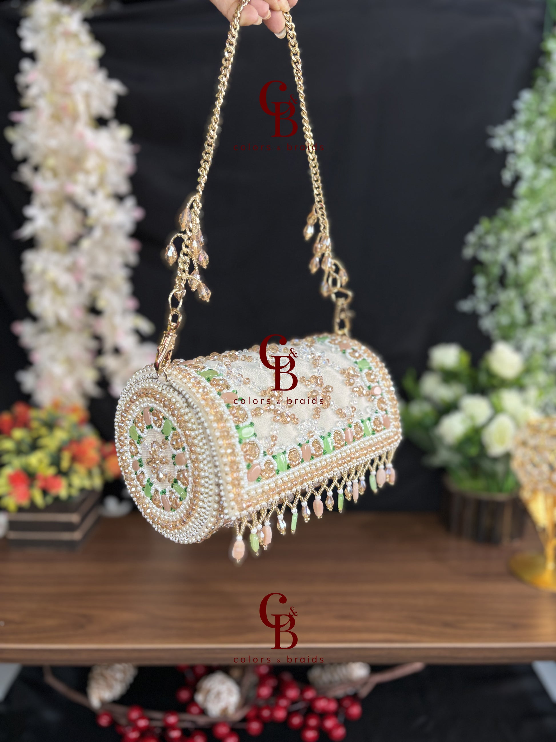 Side view of handcrafted pearl embellished barrel clutch with pastel crystal detailing