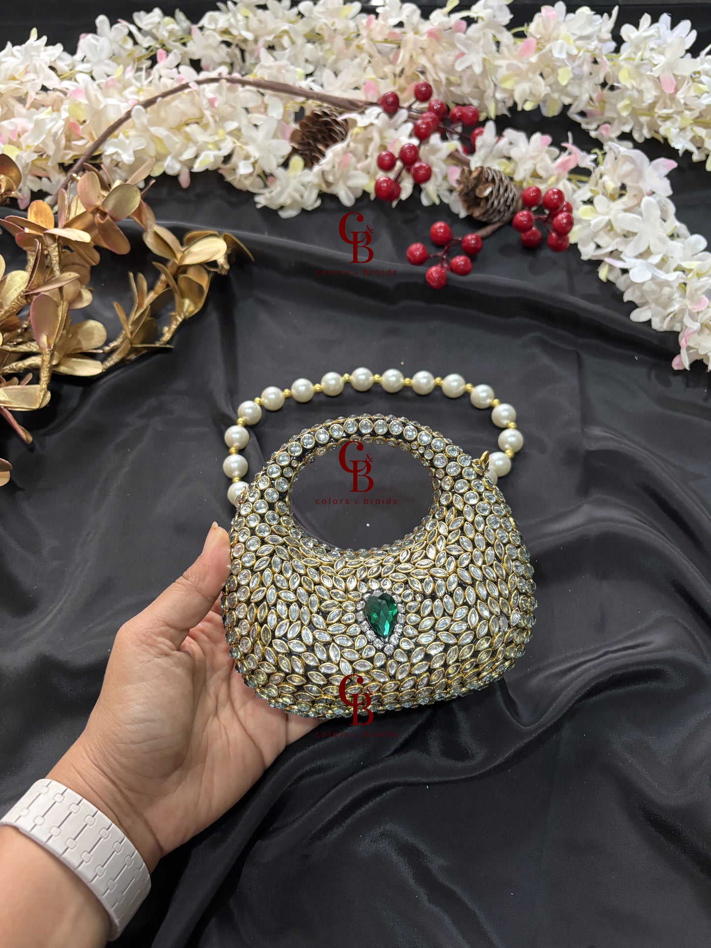 Handcrafted Kundan stone clutch with detachable pearl handle