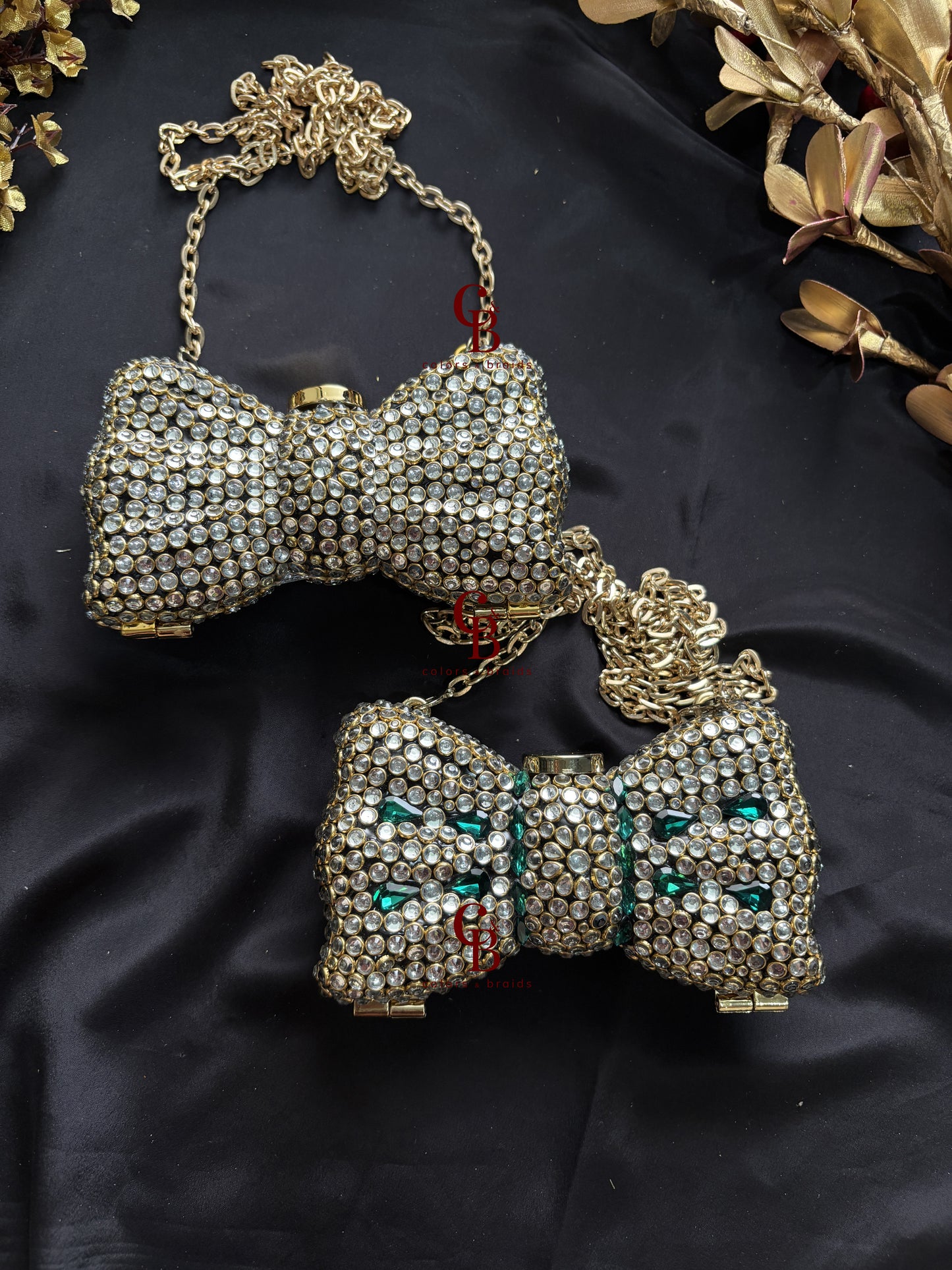 Gold Kundan bow-shaped clutch with crystal embellishment and chain strap