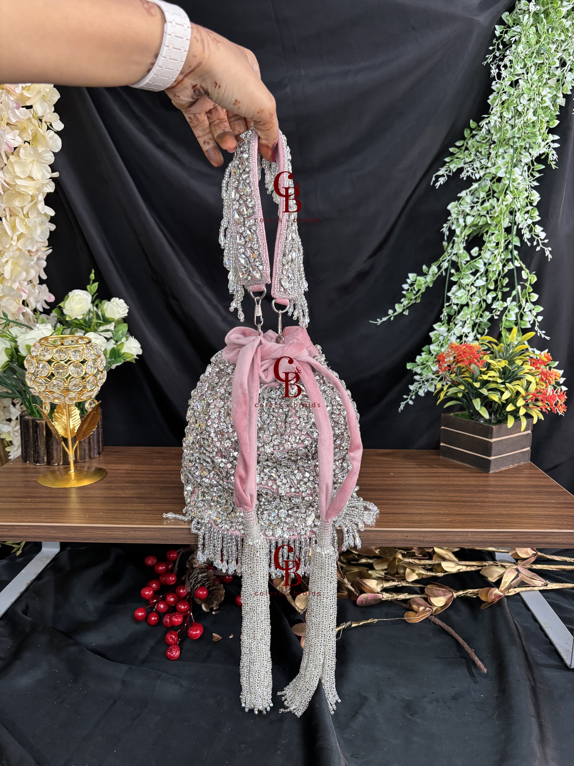 Blush pink embellished potli bag with crystal detailing and pearl handle