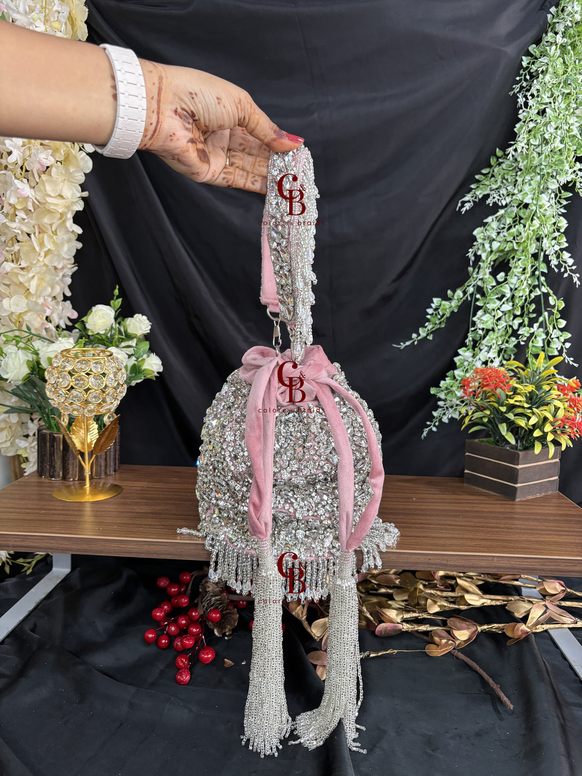 Blush pink embellished potli bag with crystal detailing and pearl handle