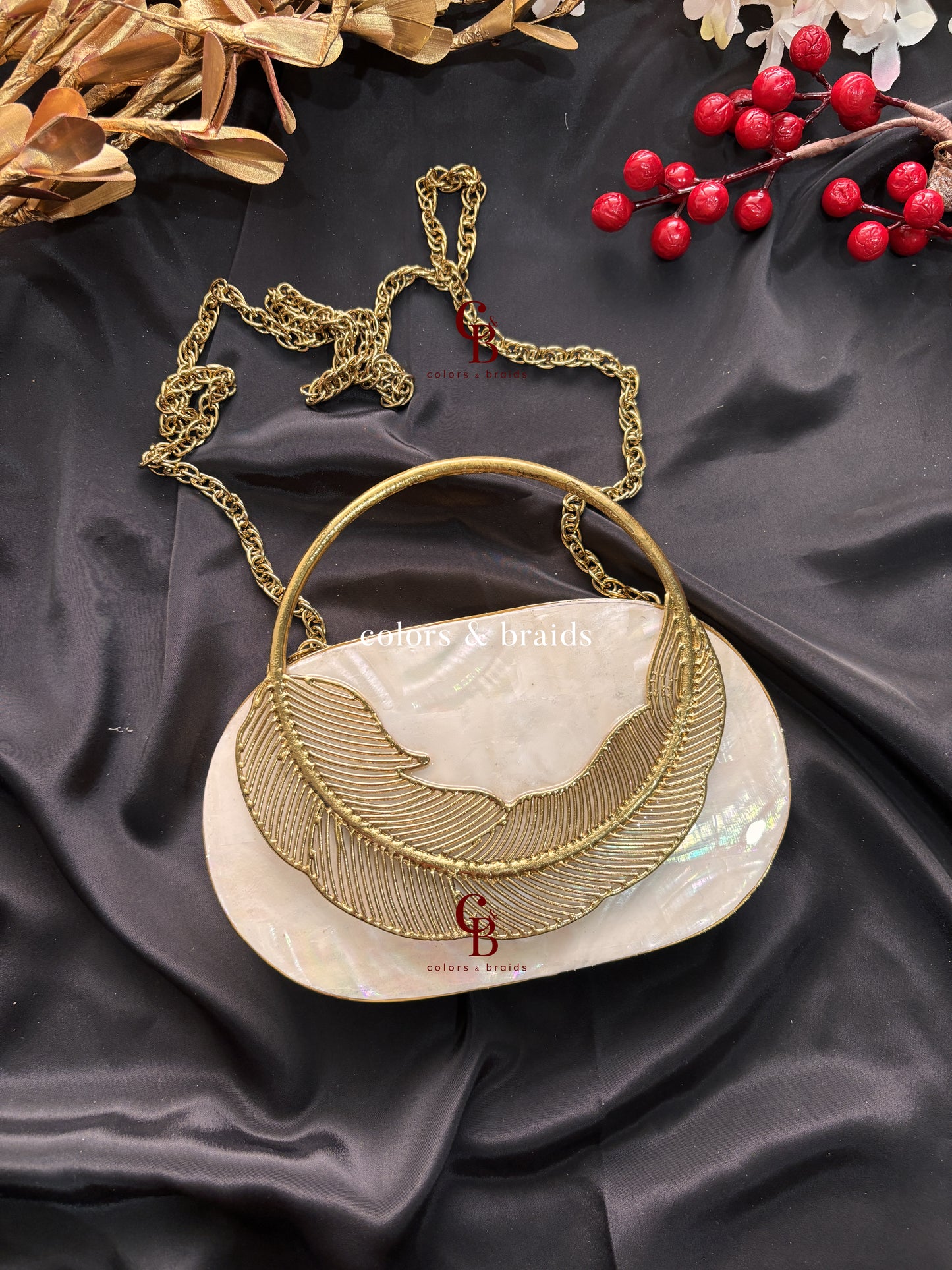 Aarvi Mother of Pearl Brass Clutch