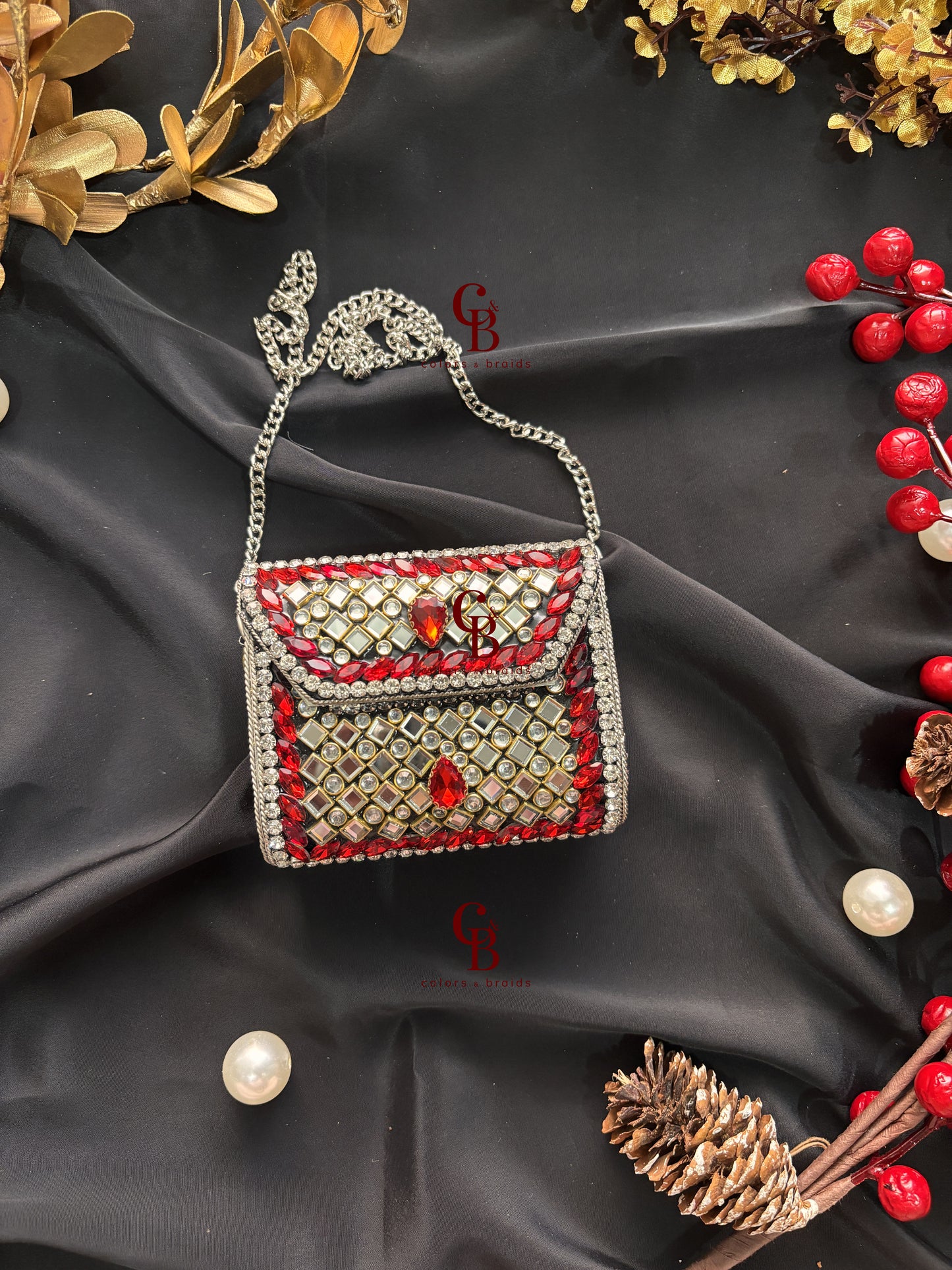Sharvi Silver Kundan Clutch - Red Stones